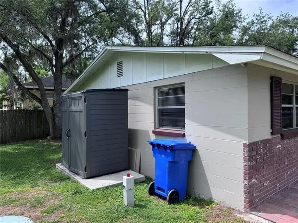 a view of a small house with a small yard