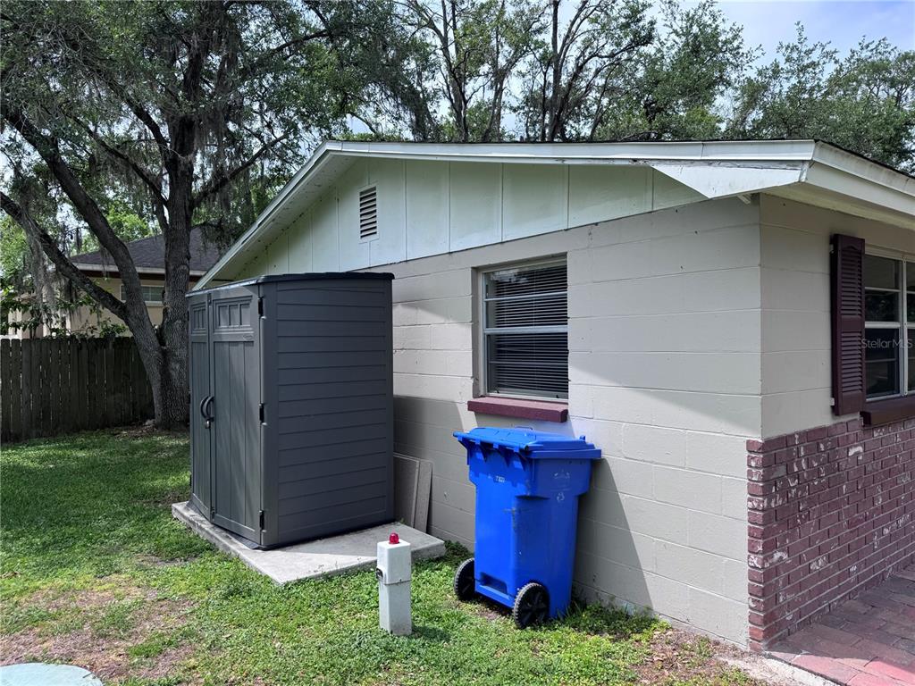 514 Winham Street Tampa, FL 33619 - Photo 13 of 15 a view of a small house with a small yard