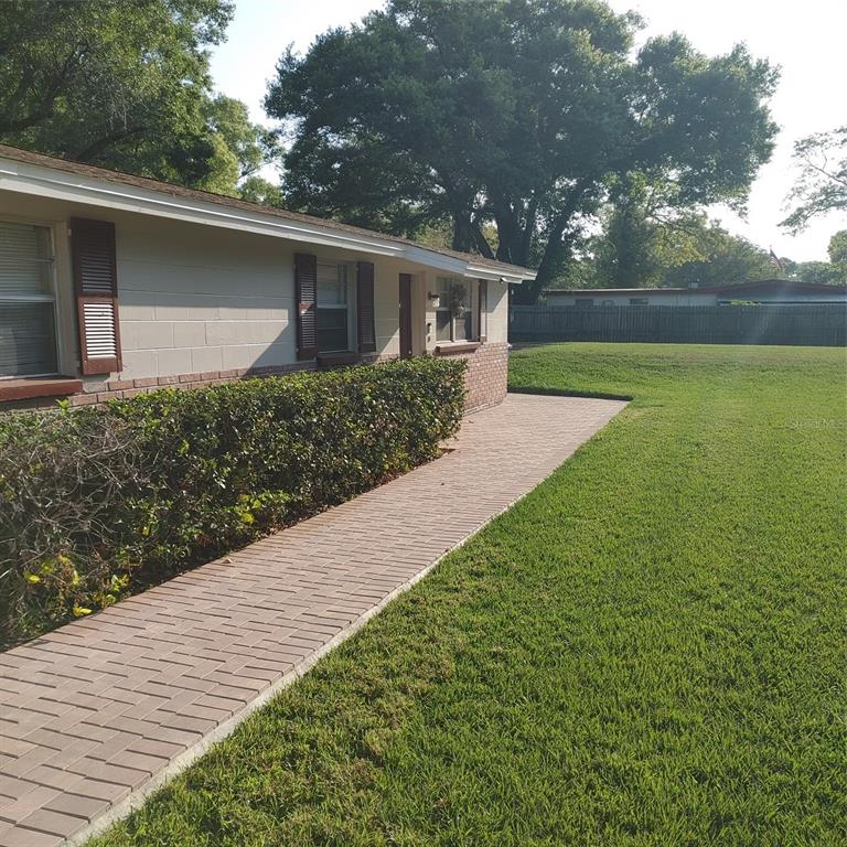 514 Winham Street Tampa, FL 33619 - Photo 15 of 15 a front view of a house with garden