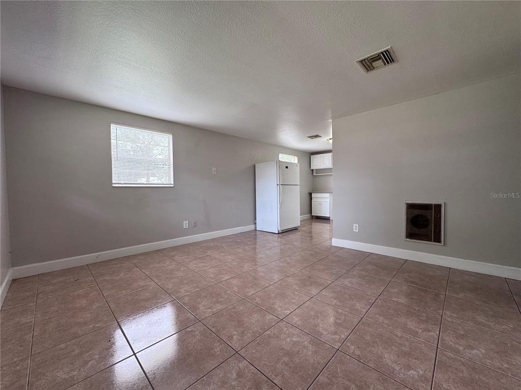 514 Winham Street Tampa, FL 33619 - Photo 2 of 15 a view of an empty room with a window