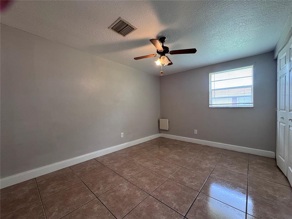 514 Winham Street Tampa, FL 33619 - Photo 6 of 15 en view of an empty room with a window