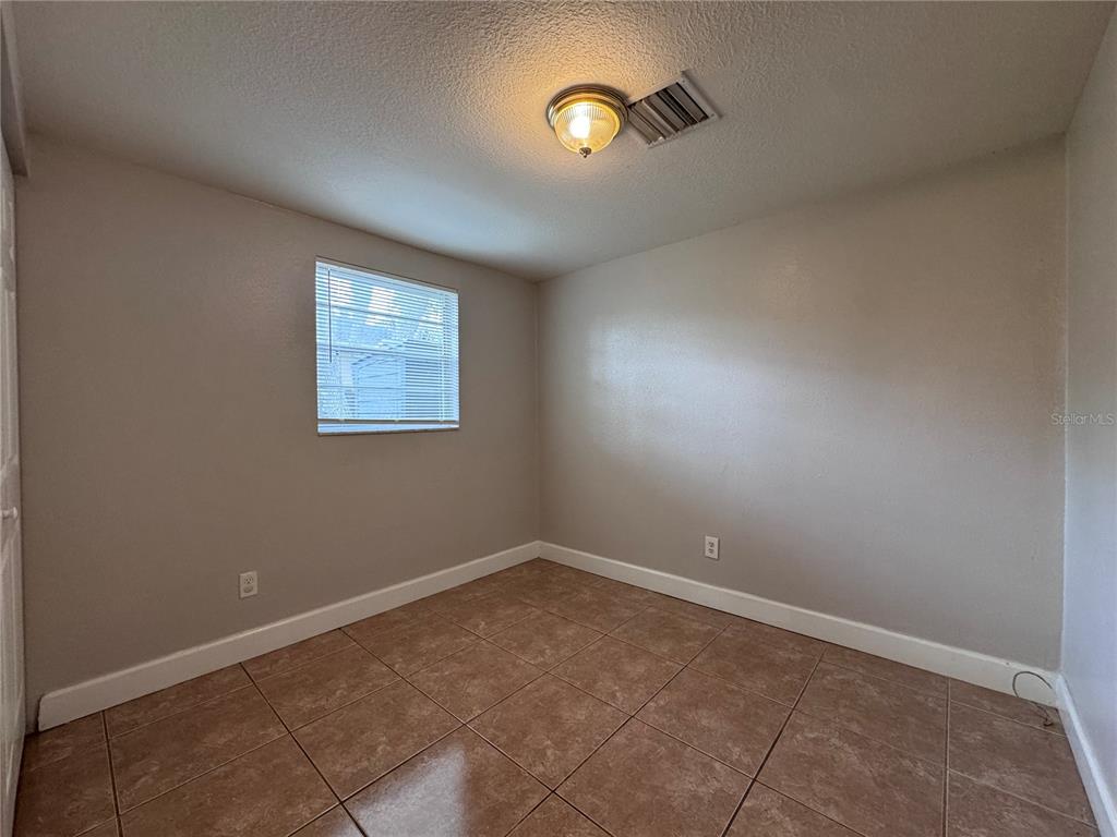 514 Winham Street Tampa, FL 33619 - Photo 10 of 15 a view of an empty room