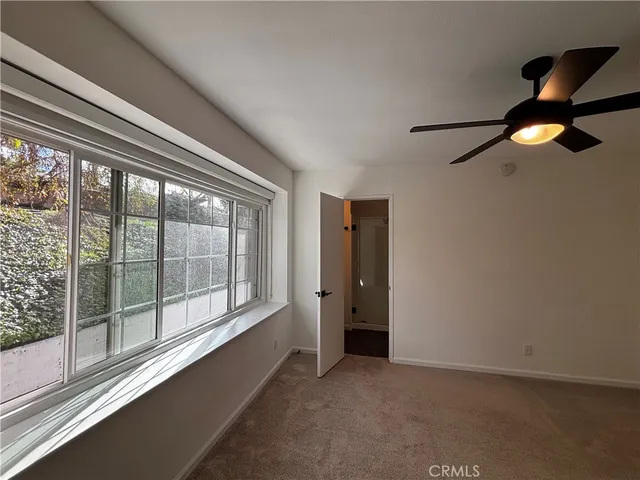 a view of empty room with windows