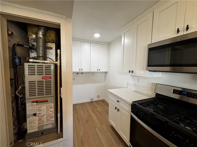 a kitchen with a stove and a microwave
