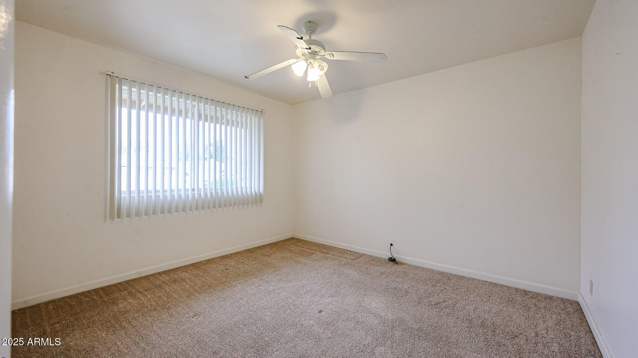 11851 North Thunderbird Road Sun City, AZ 85351 - Photo 22 of 46 a view of an empty room with a window
