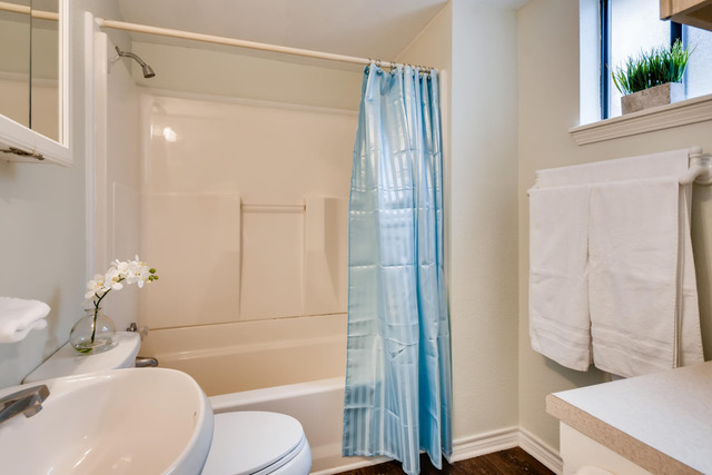 711 Jewell Street, Unit A & B Austin, TX 78704 - Photo 14 of 17 a bathroom with a sink toilet and shower