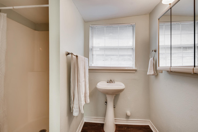 711 Jewell Street, Unit A & B Austin, TX 78704 - Photo 15 of 17 a view of a bathroom with a sink and mirror