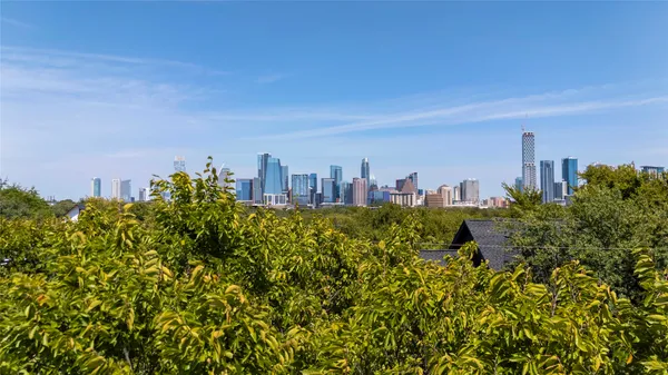a view of a city with tall buildings in front of it