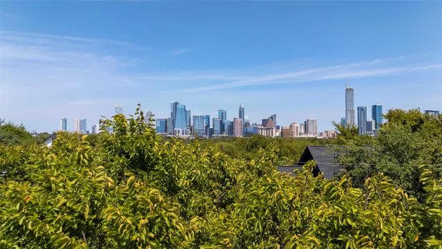 a view of a city with tall buildings in front of it