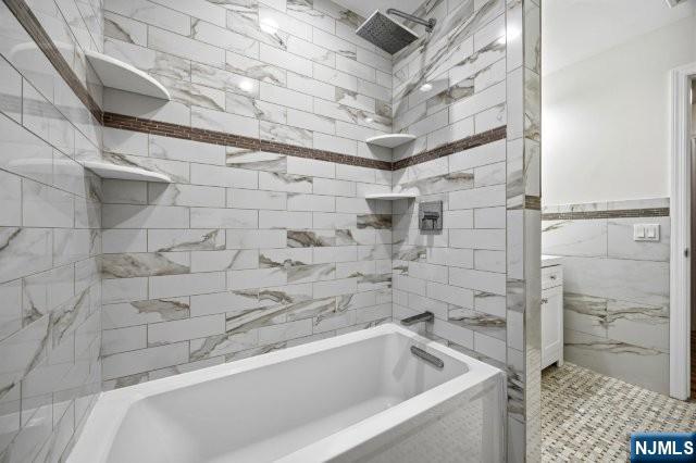 373 West Saddle River Road Upper Saddle River, NJ 07458 - Photo 18 of 31 a bathroom with a bathtub and shower