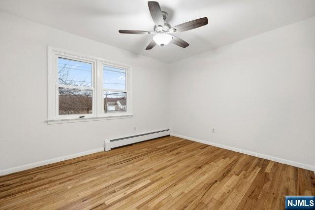 373 West Saddle River Road Upper Saddle River, NJ 07458 - Photo 19 of 31 a view of an empty room with wooden floor and a window