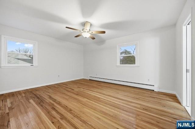373 West Saddle River Road Upper Saddle River, NJ 07458 - Photo 23 of 31 a view of an empty room with a window and wooden floor