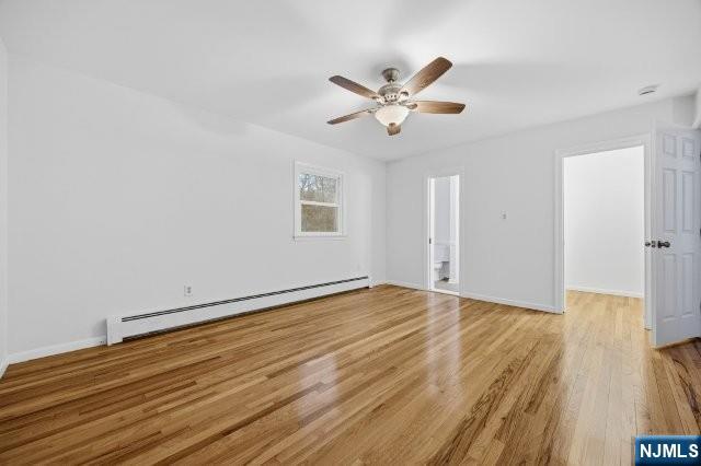 373 West Saddle River Road Upper Saddle River, NJ 07458 - Photo 24 of 31 a view of an empty room with wooden floor and a ceiling fan