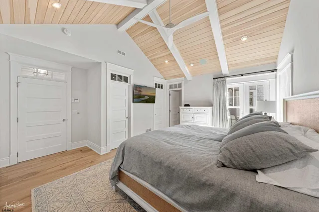 a spacious bathroom with a shower sink double and mirror