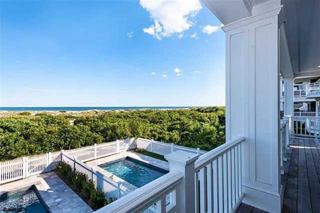 a view of a balcony with wooden floor