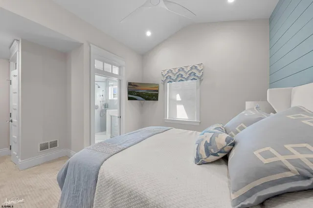 a view of a hallway with wooden floor and windows