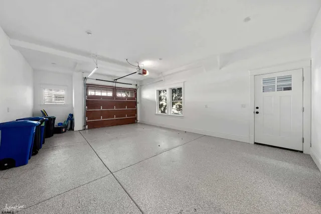 a aerial view of a house with a swimming pool and outdoor seating