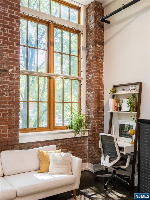 25 Clark Street, Unit 205 Glen Ridge, NJ 07028 - Photo 16 of 28 a living room with furniture and a window