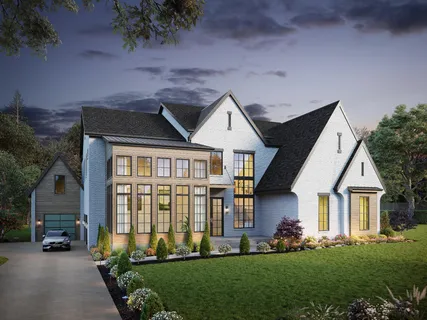 a front view of a house with a yard table and chairs