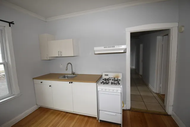 a utility room with sink dryer and washer