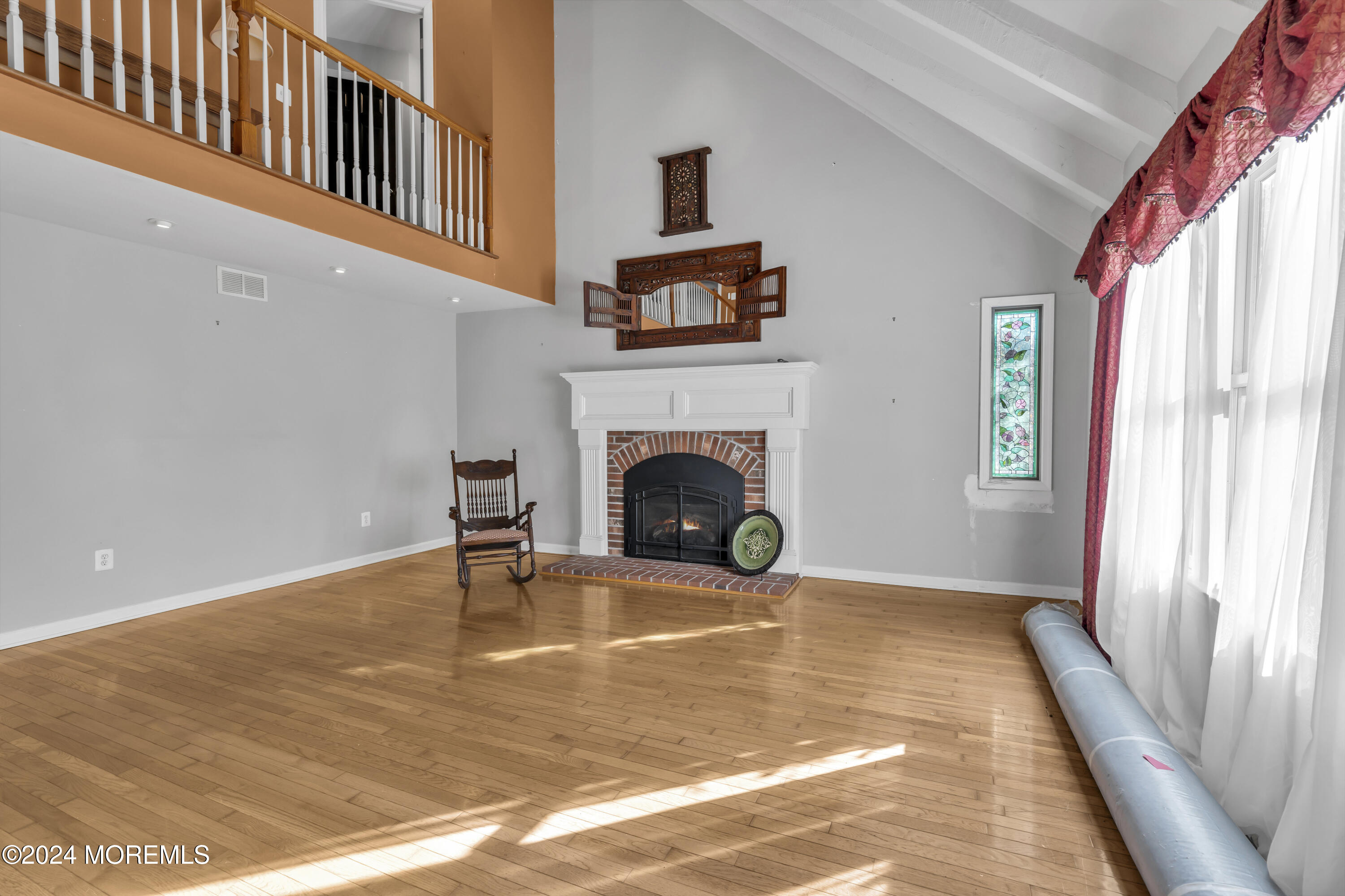 133 West Millstream Road Cream Ridge, NJ 08514 - Photo 5 of 42 a view of a livingroom with a fireplace and window