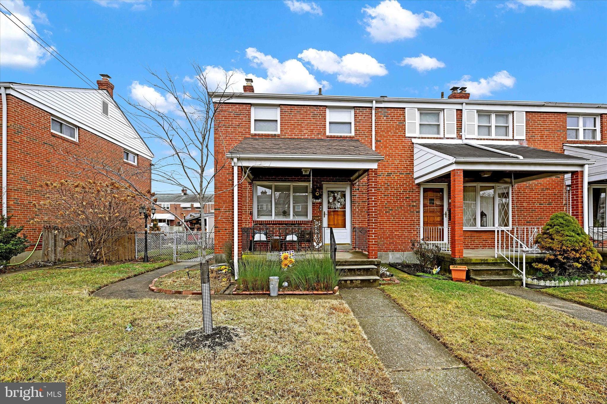 2013 Wareham Road Baltimore, MD 21222 - Photo 1 of 17 front view of house with a yard