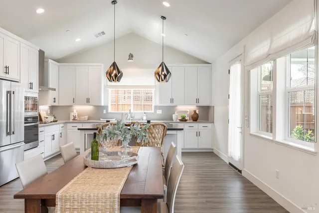 a kitchen with sink cabinets and wooden floor