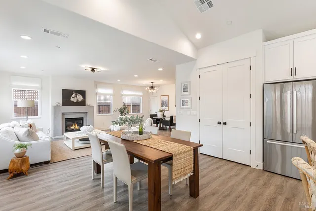 a large kitchen with a table and chairs