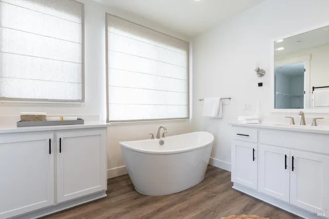 a large room with a sink and mirror