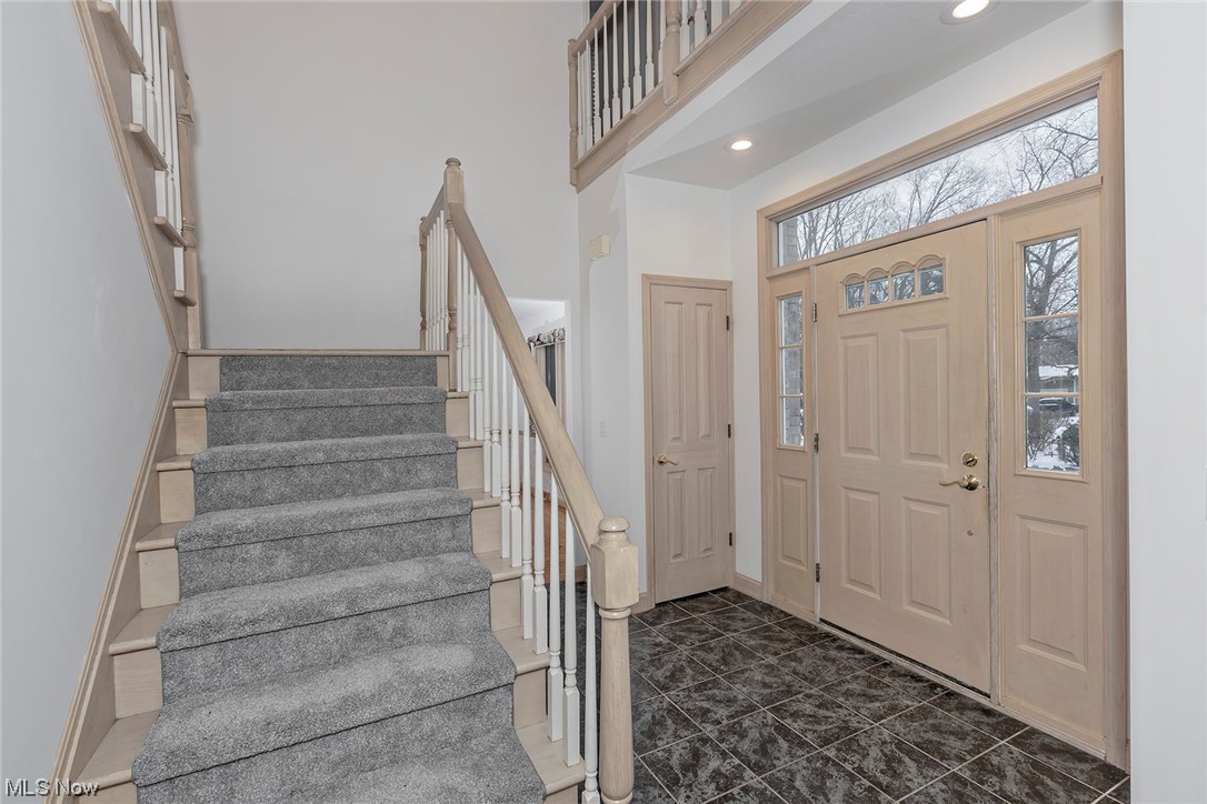 3850 Ellendale Road Moreland Hills, OH 44022 - Photo 2 of 39 Tiled foyer with two story ceiling and Chandelier. Front door with sidelights and transom window.