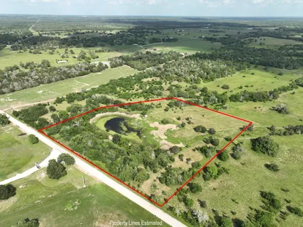an aerial view of a houses with outdoor space and a lake view