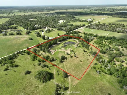 an aerial view of a golf course with outdoor space