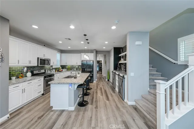 a view of a hallway with washer and dryer