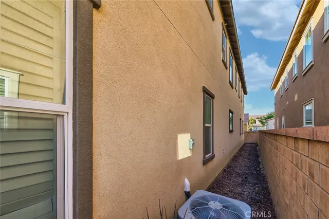 a view of a brick house with many windows