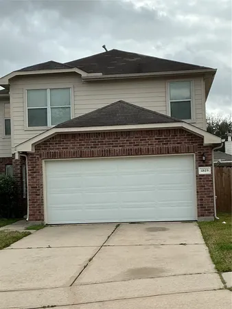 a front view of a house with a garage