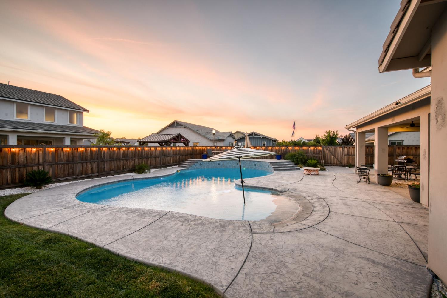 1736 North Renn Avenue Clovis, CA 93619 - Photo 50 of 66 a view of a swimming pool with a lounge chair