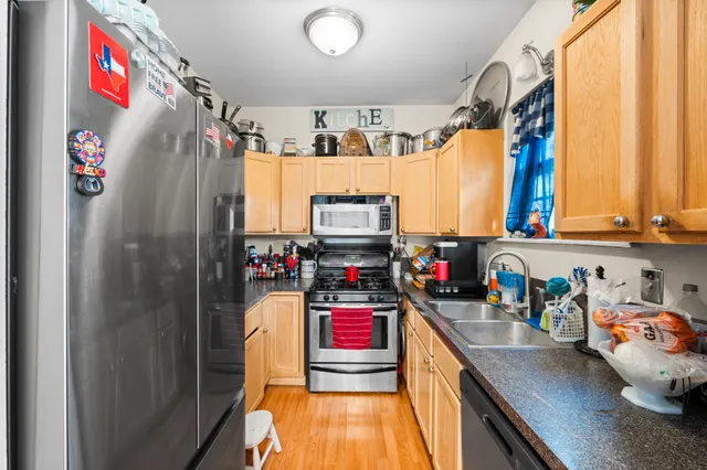 a kitchen with lots of appliances and cabinets