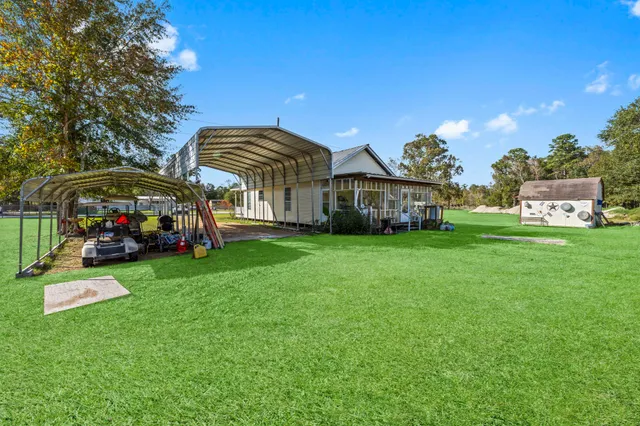 a view of a house with a big yard