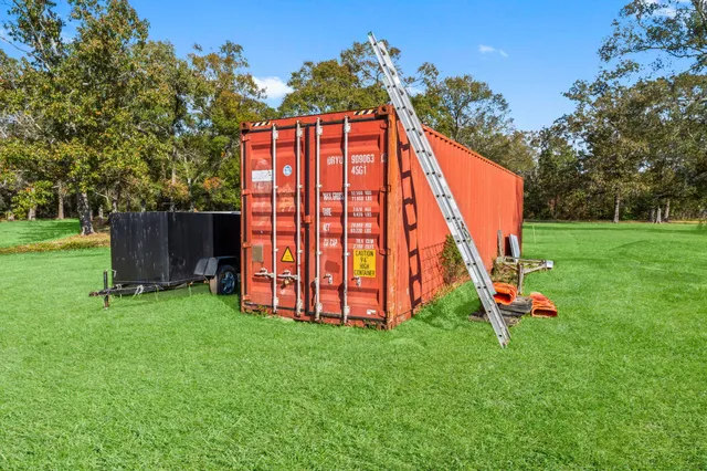 a view of a chairs and table in a yard