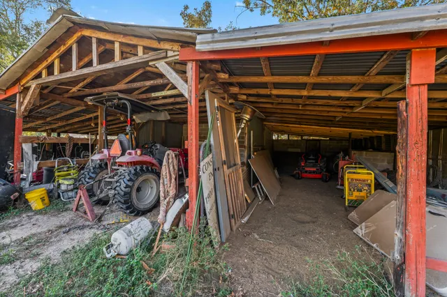a view of a house with swimming pool and porch with furniture