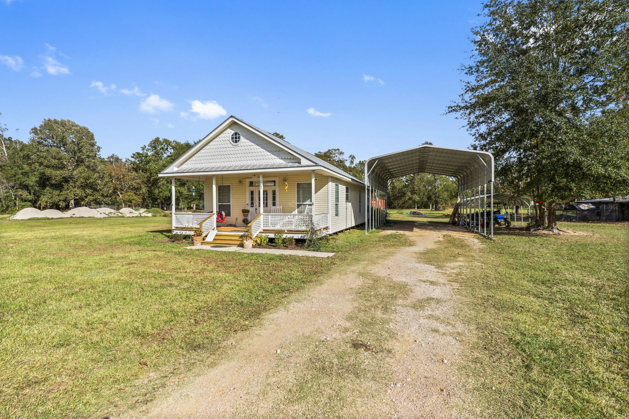 14991 North Tram Road Splendora, TX 77372 - Photo 31 of 40 a view of a house with swimming pool and porch with furniture