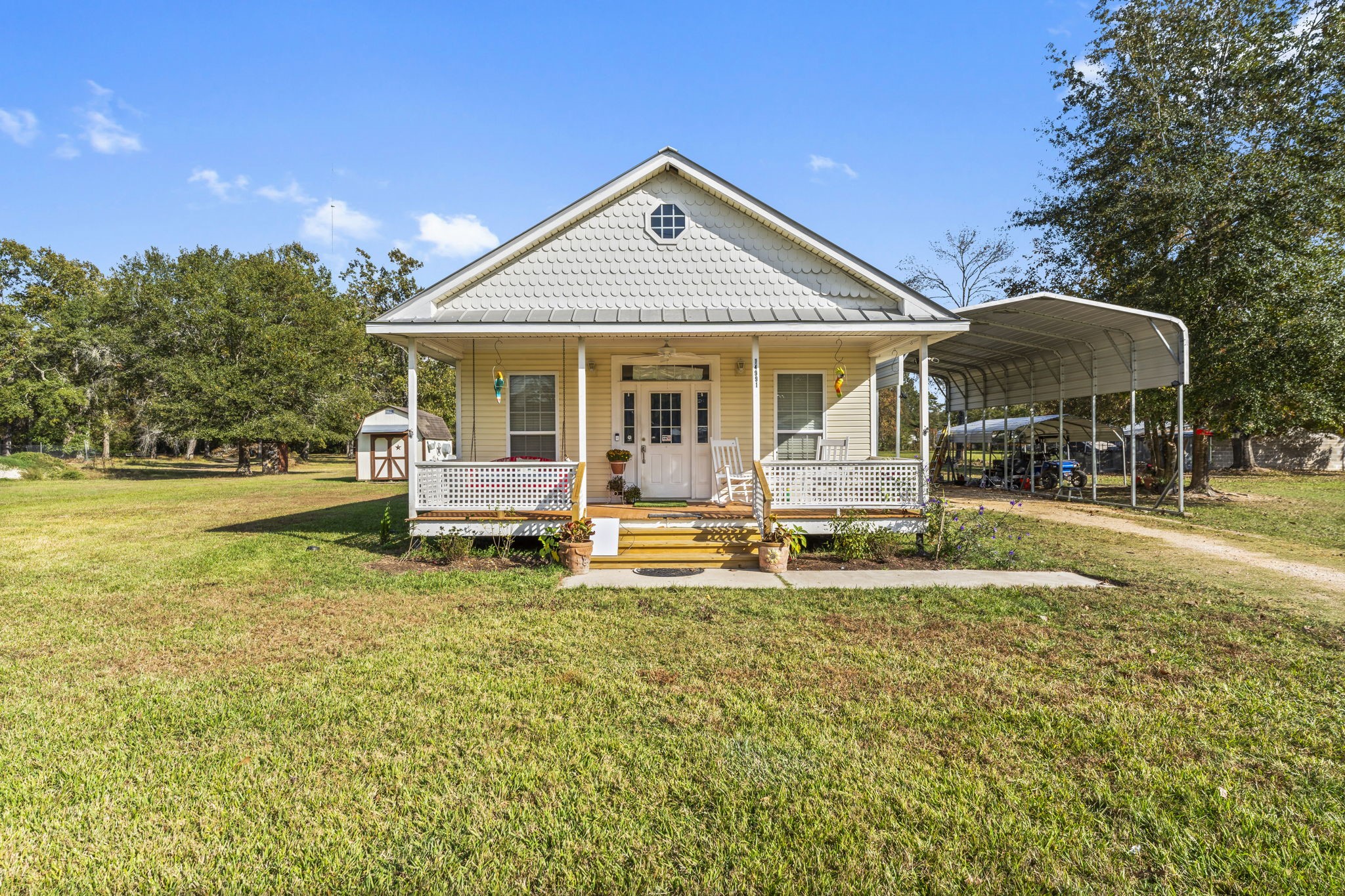 14991 North Tram Road Splendora, TX 77372 - Photo 32 of 40 a front view of a house with swimming pool having outdoor seating