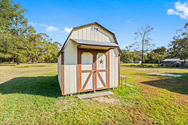a view of a front of a house with a yard