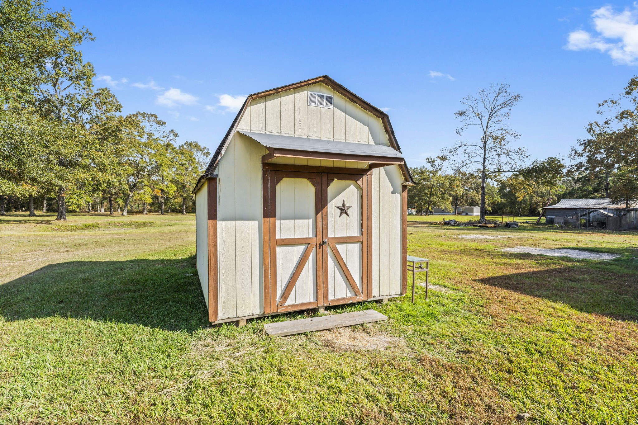 14991 North Tram Road Splendora, TX 77372 - Photo 37 of 40 a view of a tiny house with a yard