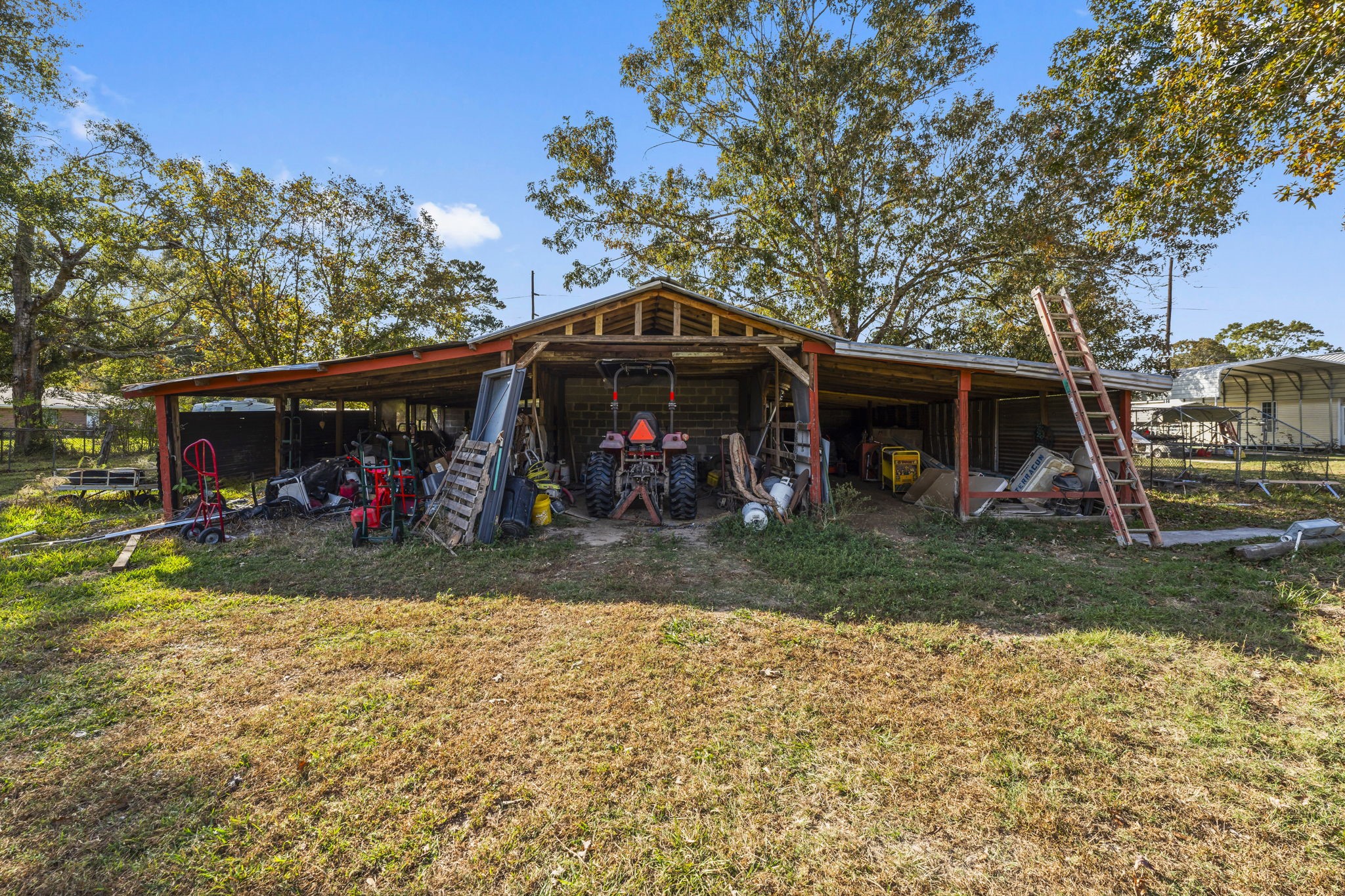 14991 North Tram Road Splendora, TX 77372 - Photo 39 of 40 a view of a front of a house with a yard
