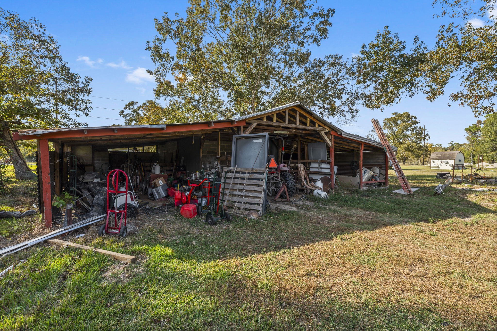 14991 North Tram Road Splendora, TX 77372 - Photo 40 of 40 a view of a car park in front of a house