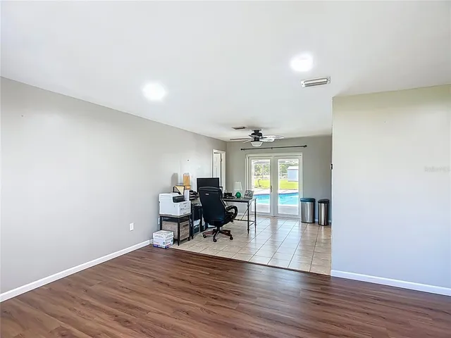 a view of a livingroom with furniture and a window