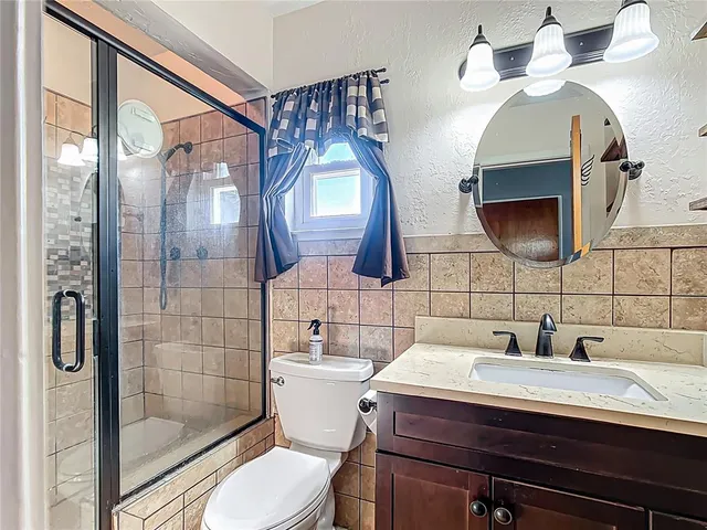 a bathroom with a sink and mirror