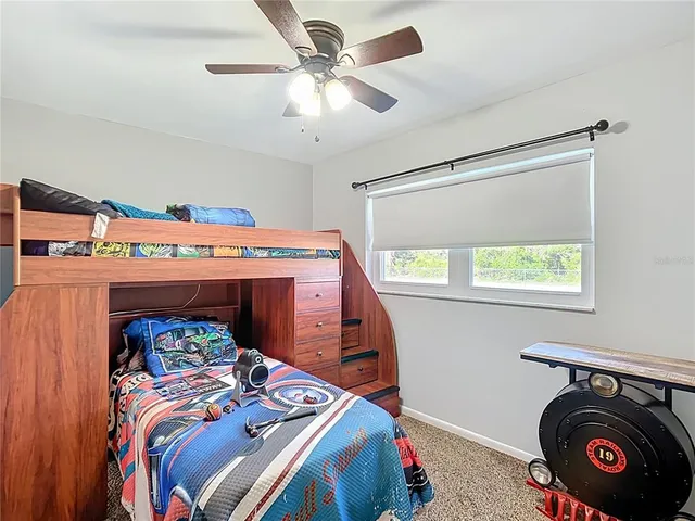 a bedroom with a bed and a washing machine