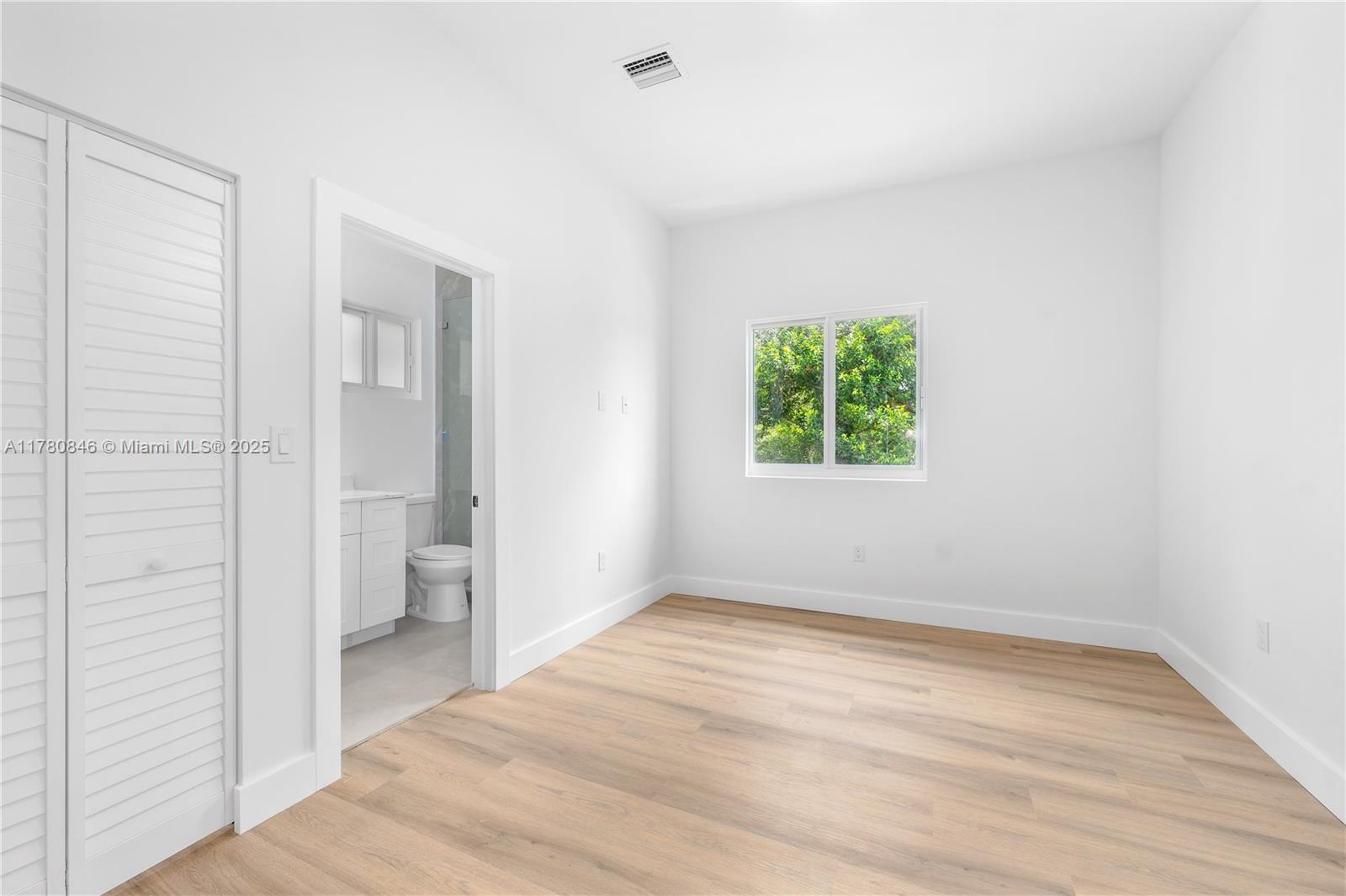 2121 Northwest 45th Street, Unit 2123 Miami, FL 33142 - Photo 13 of 24 a view of a room that has a window in it